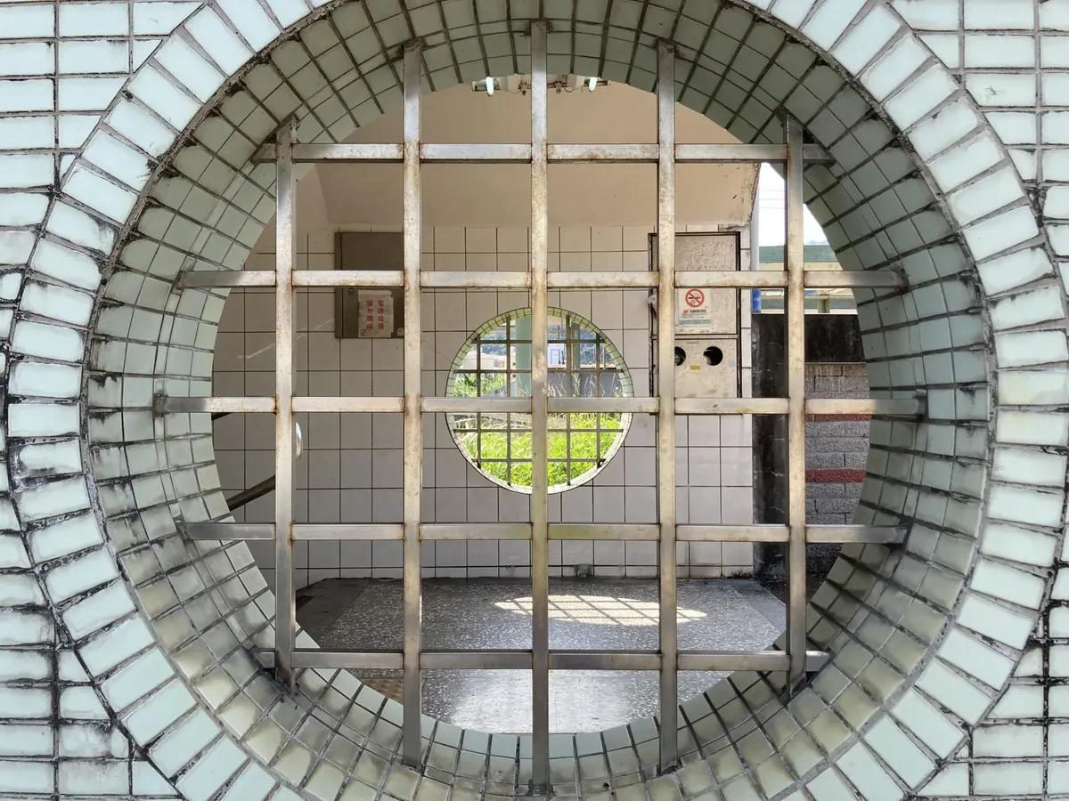 Circular tiled structure with sunlight casting shadows in Taiwan's Yilan County.